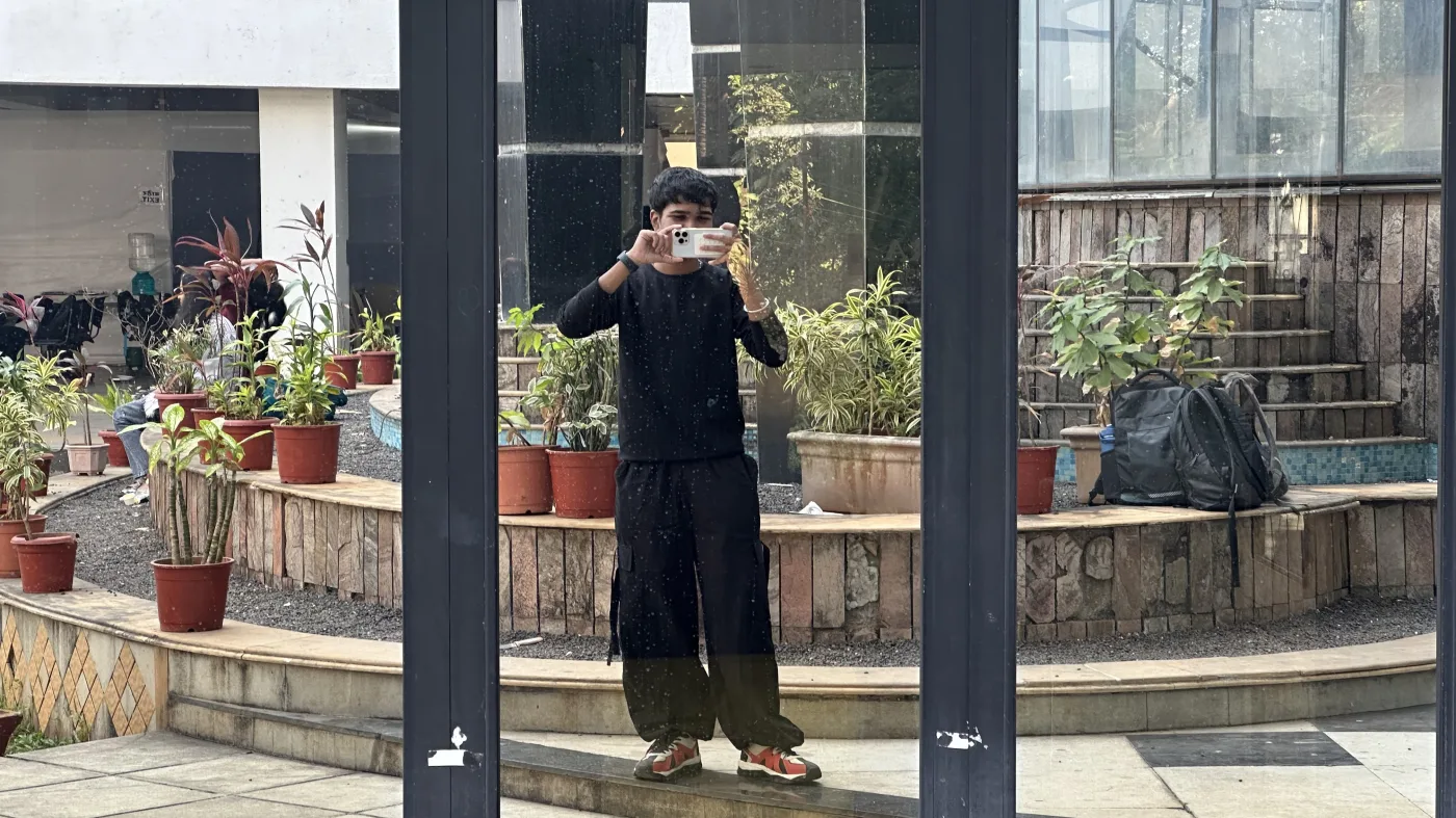 Soham outdoors in a candid landscape portrait